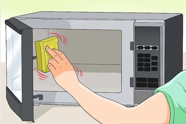 Lau lò vi sóng bằng miếng bọt biển ướt hoặc khăn giấy Lau lò vi sóng bằng miếng bọt biển ướt hoặc khăn giấy