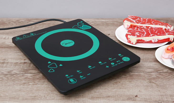 Bếp từ Midea MI-T2120DD phủ màu đen - xanh ngọc đẹp mắt, sang trọng, kiểu dáng nhỏ gọn, tiện sử dụng trong không gian bếp nhỏ hẹp